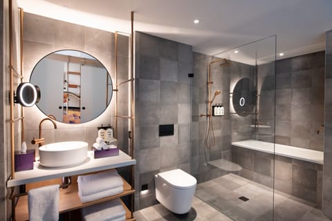 Suite, 1 Twin Bed, Balcony (Indigo Balcony) | Bathroom | Shower, hydromassage showerhead, designer toiletries, hair dryer