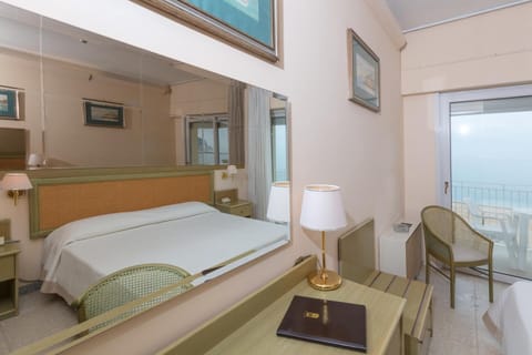 Economy Double or Twin Room, Sea View | Minibar, in-room safe, desk, free WiFi