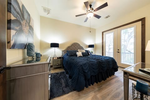 A King Bed , Smart TV , Dresser and Vanity in the master bedroom 