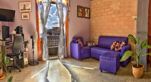 Classic Quadruple Room | Living area | Fireplace