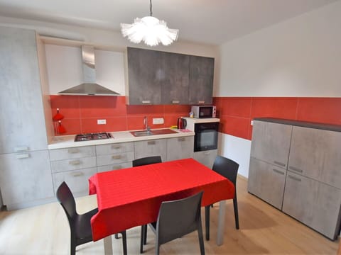 Furniture, Room, Property, Interior Design, Red, Building, Kitchen, Cabinetry, Countertop, Dining Room