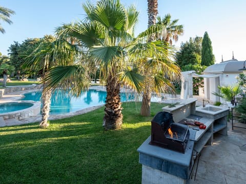 Plant, Sky, Water, Tree, Botany, Outdoor Furniture, Shade, Arecales, Building, Landscape