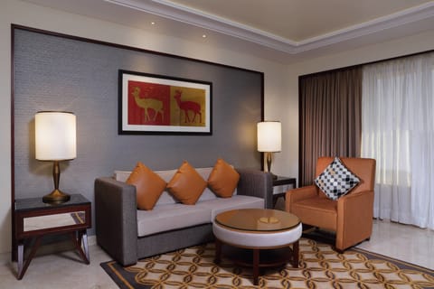 Executive Suite, 1 Bedroom, Non Smoking | Living room | 42-inch flat-screen TV with satellite channels, TV, DVD player