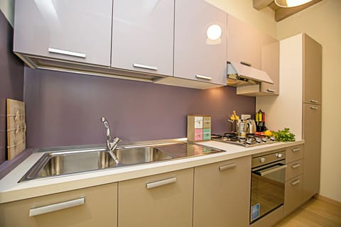 Family Apartment, 2 Bedrooms (Residenza Il Cavaliere del Lago) | Private kitchen | Full-size fridge, microwave, oven, stovetop