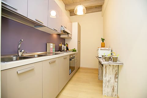 Family Apartment, Multiple Bedrooms (Residenza Il Cavaliere del Lago) | Private kitchen | Full-size fridge, microwave, oven, stovetop