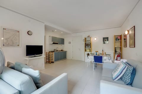 Family Apartment, 1 Bedroom, Lakeside (Residenza Lago D'Argento) | Living room | Flat-screen TV