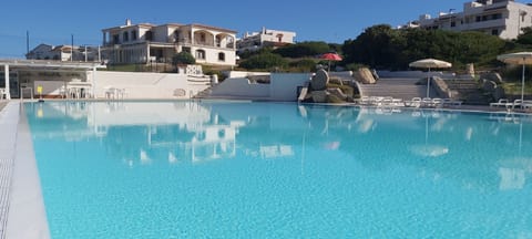 Seasonal outdoor pool, pool umbrellas, sun loungers