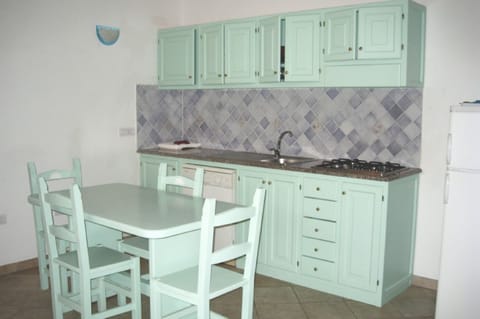 Apartment, Sea View | Private kitchenette | Fridge, stovetop, dishwasher, cookware/dishes/utensils