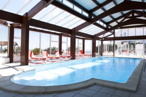 Indoor pool, open 9 AM to 9 PM, pool umbrellas, sun loungers