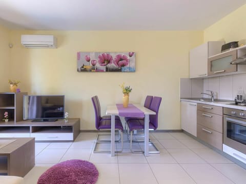 Property, Furniture, Cabinetry, Building, Countertop, Purple, Table, Kitchen, Lighting, Chair