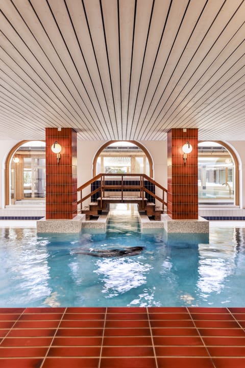 Indoor pool, seasonal outdoor pool, pool umbrellas, sun loungers