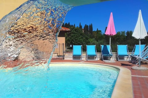 Seasonal outdoor pool, open 9:00 AM to 7:00 PM, sun loungers