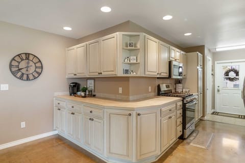 The kitchen features a Keurig coffee maker with assorted complementary coffees and teas!
