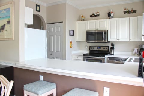 Condo, 2 Bedrooms | Private kitchen | Full-size fridge, microwave, oven, stovetop