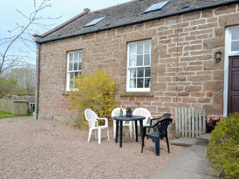 Small sitting-out area with garden furniture | Cloud Howe - Arbuthnott Estate Cottages, Arbuthnott, near Stonehaven