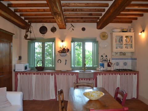 Cottage | Private kitchen | Highchair, cookware/dishes/utensils, dining tables