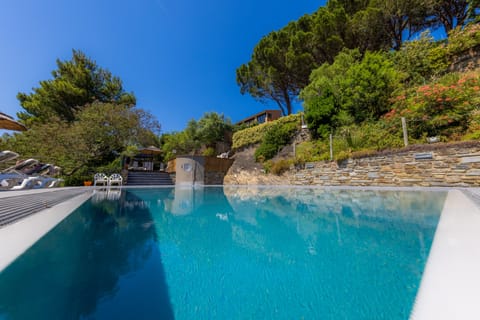 Seasonal outdoor pool, open 9:00 AM to 8:00 PM, pool umbrellas