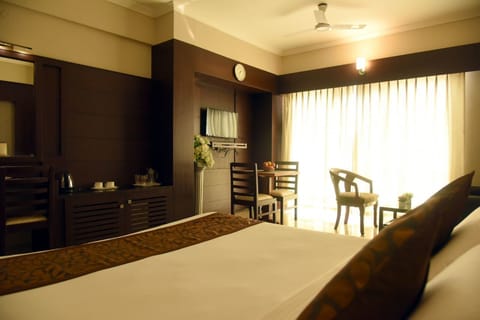 Suite, 1 King Bed | Living area | LCD TV, pay movies