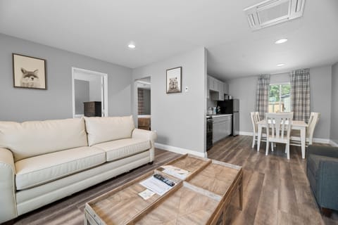 Premium Duplex | Living area | Flat-screen TV, fireplace, books, video library