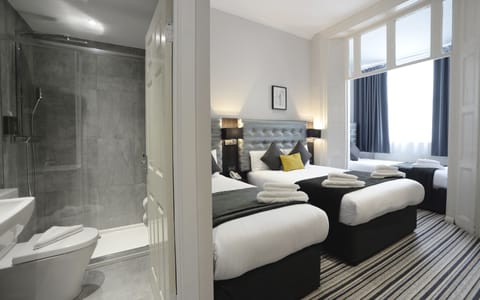 Quadruple Room | Select Comfort beds, in-room safe, desk, soundproofing
