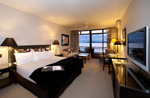 Junior Suite King with Lake View | Premium bedding, in-room safe, individually furnished, desk