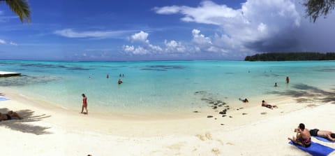 On the beach, white sand, beach towels, snorkeling