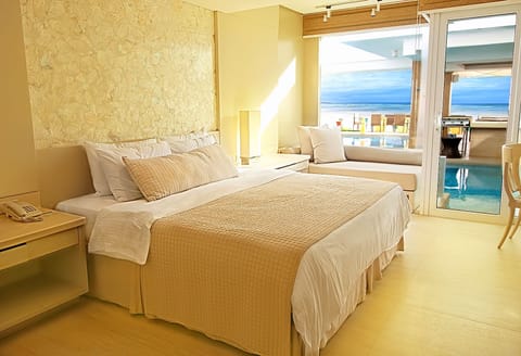 Deluxe Room, 1 King Bed, Pool Access | Minibar, in-room safe, desk, free WiFi