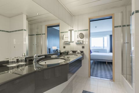 Suite, 1 Bedroom | Bathroom | Combined shower/tub, deep soaking tub, free toiletries, hair dryer