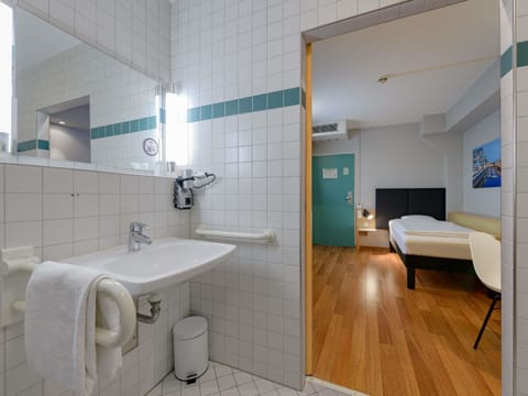 Shower, eco-friendly toiletries, hair dryer, towels