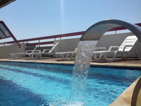 Outdoor pool, open 6:00 AM to 10:00 PM, sun loungers