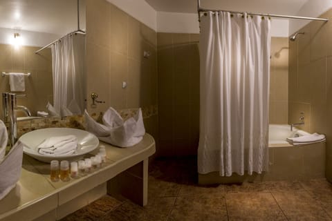 Panoramic Quadruple Room | Bathroom | Shower, designer toiletries, hair dryer, towels