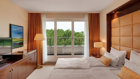 Premium bedding, down comforters, minibar, in-room safe