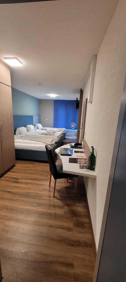 Economy Quadruple Room | Premium bedding, Select Comfort beds, in-room safe, desk