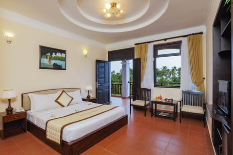 Deluxe Room, Pool View | Living area | LCD TV