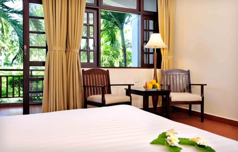 Deluxe Room, Pool View | Minibar, in-room safe, desk, blackout drapes