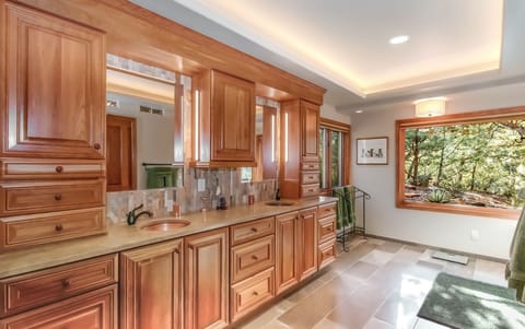 The en-suite master is luxurious with radiant floor heating, dual copper sinks, marble countertops and stunning views