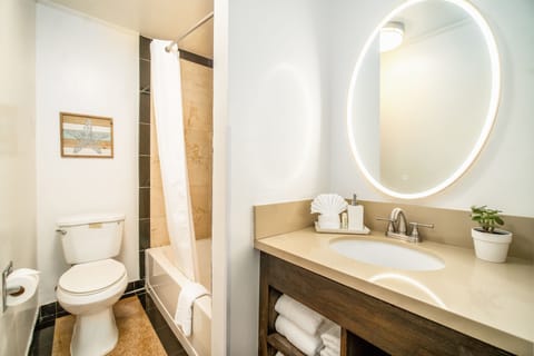 Deluxe Room, 2 Queen Beds | Bathroom | Shower, hair dryer, towels, soap