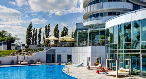 Indoor pool, outdoor pool, pool umbrellas, sun loungers