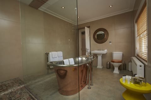 Copper Rooms | Bathroom | Designer toiletries, hair dryer, towels