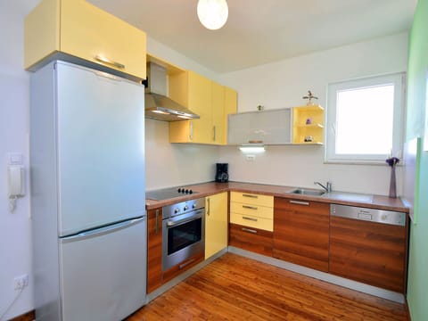 Room, Property, Kitchen, Countertop, Cabinetry, Furniture, Yellow, Building, Floor, House