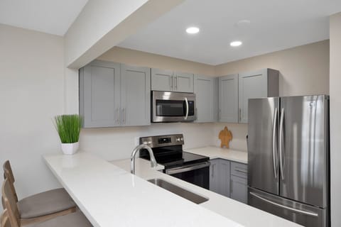 Townhome | Private kitchen | Fridge, coffee/tea maker, toaster oven