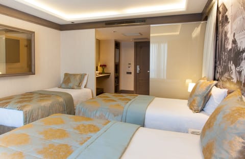 Standard Triple Room | Premium bedding, in-room safe, individually furnished, desk