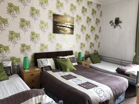 Family Room, Shared Bathroom (Room 4) | Iron/ironing board, free WiFi, bed sheets