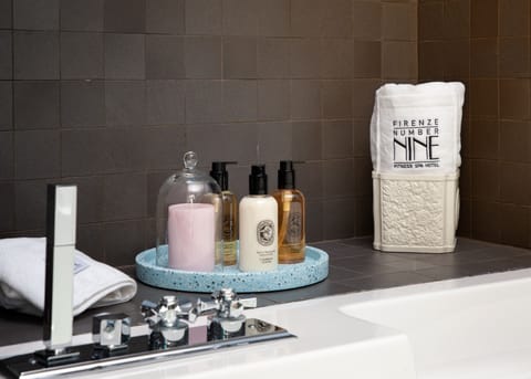 Junior Suite | Bathroom | Rainfall showerhead, designer toiletries, hair dryer, bathrobes