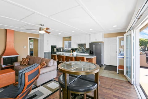 If you want to sit in the breeze, but not outside, this smaller table is a perfect spot to sit and hang-out!