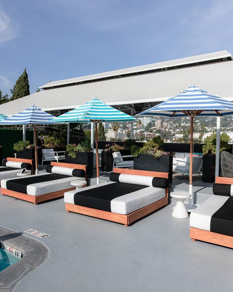 Outdoor pool, open 7 AM to 11 PM, cabanas (surcharge), pool umbrellas