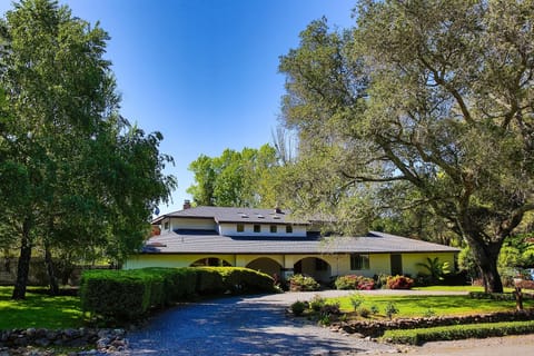 Front of house. Parking for up to 5 cars in the driveway and garage.