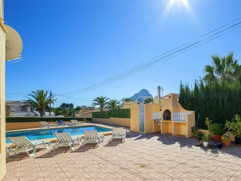 Sky, Plant, Building, Azure, Tree, Shade, House, Arecales, Outdoor Furniture, Flowerpot