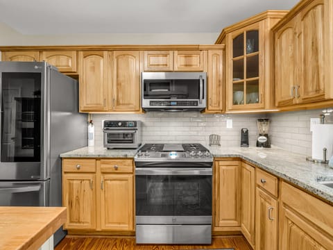 Modern appliances meet rustic design for a kitchen that’s as functional as it is inviting.