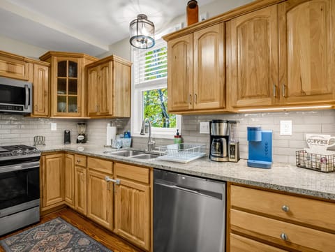 Brew a fresh cup in the Keurig or a whole pot for the family in the drip machine, watch the trees sway, and let the mountain calm settle in while you start your day.